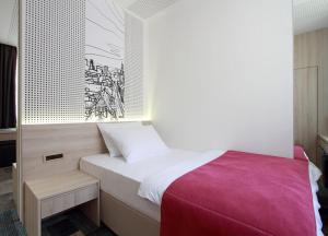 Letto o letti in una camera di Hotel Cosmopolit