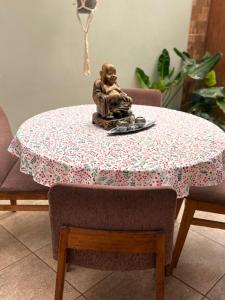 a statue of a monkey sitting on a table at Casa de Melinka in Mejillones