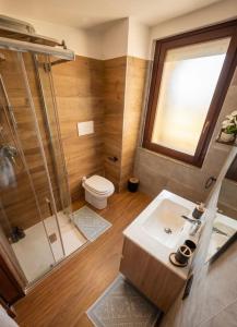 a bathroom with a shower and a sink and a toilet at Casa Cesare in Cagliari +7 photos