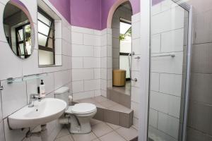 a bathroom with a toilet and a sink and a shower at Clearview Estuary Apartments in East London +40 photos