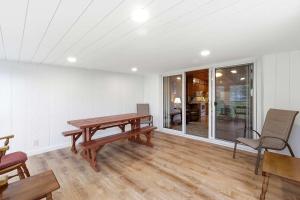 a dining room with a wooden table and chairs at Chalet #39 in Stevensville