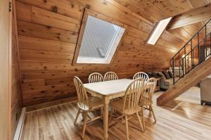 a dining room with a table and chairs at Chalet #39 in Stevensville