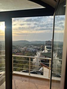 a view of a city from a balcony at Kruja Grande Hotel in Krujë