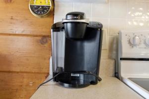 a coffee maker sitting on top of a counter at Chalet #29 in Stevensville