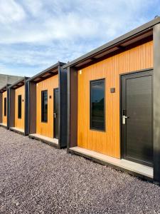 a row of modular homes with orange walls and windows at Suite Home Sinop in Sinop