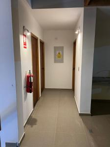 a hallway of a building with a fire hydrant at Residencia Privé in Ica