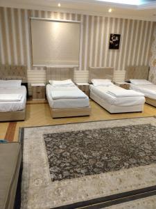 a room with three beds and a carpet at Villa Marmara in Medina +64 photos