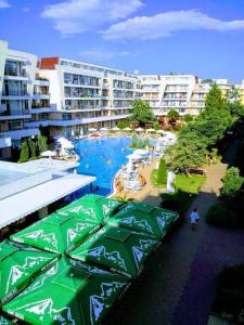 a view of a pool in a resort with buildings at Luxury Penthouse Studio with Outdoor Hot Tub and Panoramic Views in Sunny Beach +29 photos
