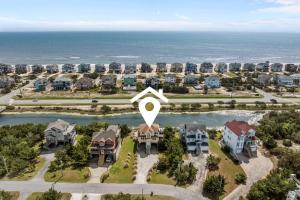 an aerial view of a villa with the ocean in the background at 7680 - Sandy Bottom in Avon