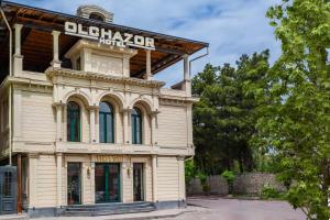 an old building with a sign on top of it at Olchazor hotel in Tashkent +17 photos