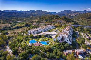 an aerial view of a resort with mountains in the background at Parque Botanico Resort Country club in Estepona