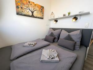 a bedroom with two beds with towels on them at Panorama-Meerblick am Scharbeutzer Strand in Scharbeutz +22 photos