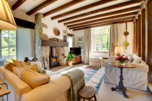 a living room with a couch and a fireplace at 3 Bed in Carr Bank oc-gl128 in Beetham