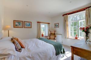 a bedroom with a bed and a desk and a chair at 3 Bed in Carr Bank oc-gl128 in Beetham