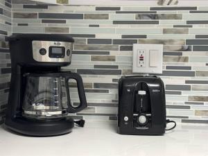 a coffee maker and a blender on a counter at 3315-Magic StudioCondo near Universal in Orlando +46 photos