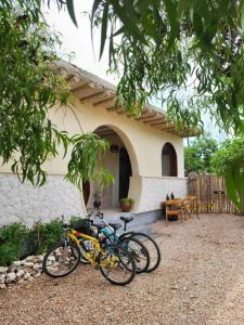 two bikes parked in front of a house at Hakuna Marika in Umbuji