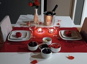 a table with plates of food and a bottle of wine at Casa do Faial da Terra in Faial da Terra +23 photos