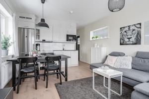 a living room with a couch and a table at Kungsberget Ski apartment 31C in Järbo +1 photo