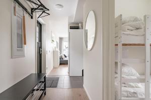 a small apartment with a hallway with bunk beds at Kungsberget Ski apartment 31C in Järbo