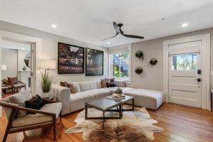 a living room with a couch and a table at Cozy Charming Historic Home in Savannah