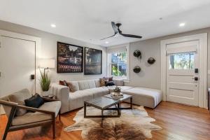 a living room with a couch and a table at Cozy Charming Historic Home in Savannah +3 photos