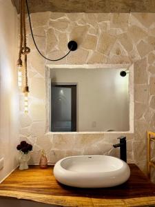 a bathroom with a white sink and a mirror at Casa Once in Las Terrenas