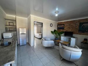 a bathroom with two sinks and two tubs in it at Vista Ree Guesthouse Pty Ltd in Taung