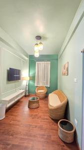 a room with two toilets in a room with green walls at Celeste Inn in Shillong