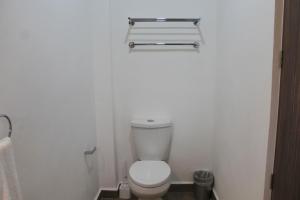a bathroom with a white toilet in a room at Single Suite Unbeatable Location Internet b34 in Casa Blanca La Corregidora +28 photos