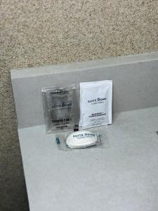 two packs of scented candles sitting on a shelf at Suite Home Sinop in Sinop +15 photos