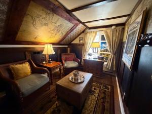a living room with a couch and a table at A Williamsburg White House Inn in Williamsburg