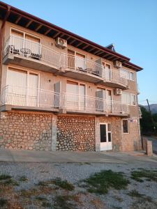 a building with balconies on the side of it at Villa Andrej Elshani in Ohrid