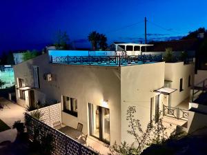 a house with a balcony on top of it at night at Luxury house Prestige Split in Split