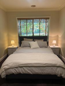 a bedroom with a large bed with two lamps at La Dolce Vita in Ancona +15 photos