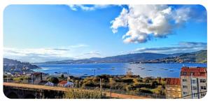 a view of a large body of water with boats at Casa Lali in Redondela