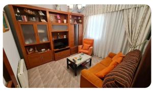 a living room with a couch and a table at Casa Lali in Redondela