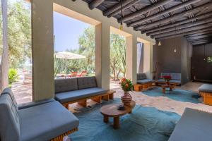 a living room with couches and a table at Villa ouidane in Marrakesh
