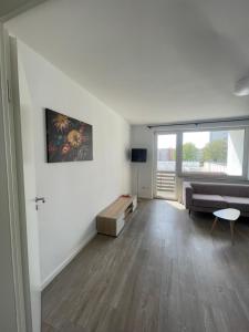 a living room with a couch and a table at Wohnen Nähe Salzgittersee in Salzgitter