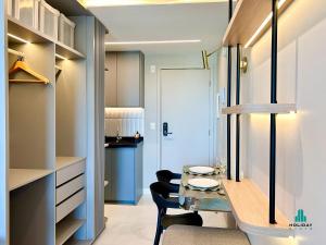 a kitchen and dining room with a table and chairs at Fortaleza Sul Prime By Holiday Stays in Fortaleza +123 photos