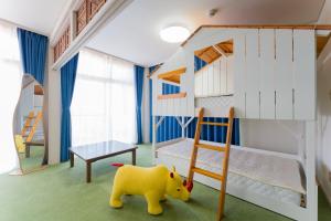 a childs bedroom with a bunk bed and a toy elephant at 全室オーシャンビューの宿 ルーチェ須崎 in Shimoda
