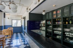 a bar with a black counter and some bottles of wine at 全室オーシャンビューの宿 ルーチェ須崎 in Shimoda