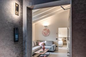 a living room with a couch and a table at Seety Spartaco in Milan