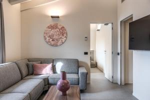 a living room with a couch and a table at Seety Spartaco in Milan +291 photos