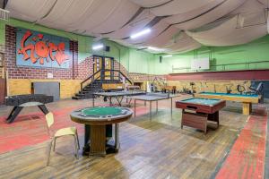 a room with ping pong tables and ping pong balls at Direct Warrior Trail Access! Ultimate ATV Getaway in Gary