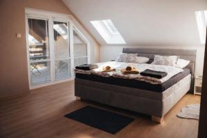 a bedroom with a bed with two teddy bears on it at Villa Nirvána in Františkovy Lázně +30 photos