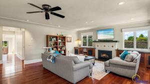 a living room with two couches and a fireplace at Ohana in Santa Cruz