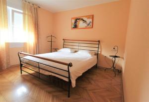 a bedroom with a bed and a window at House Casa Fabris with Pool in Umag +20 photos