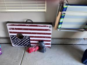 a suitcase with an american flag on the floor at Sunset Beach townhome close to everything in Ocean Isle Beach