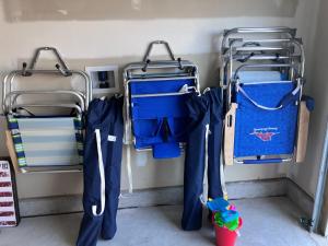 two blue umbrellas are hanging in a room at Sunset Beach townhome close to everything in Ocean Isle Beach
