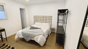 a bedroom with a bed and a ladder in it at HDEZfalcon in Las Lagunas